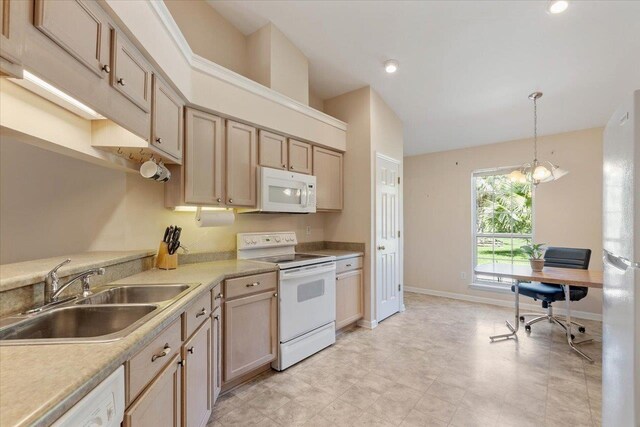 kitchen with sink, light brown cabinetry, an inviting chandelier, decorative light fixtures, and white appliances