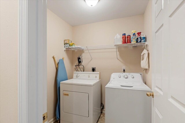 washroom with washer and dryer