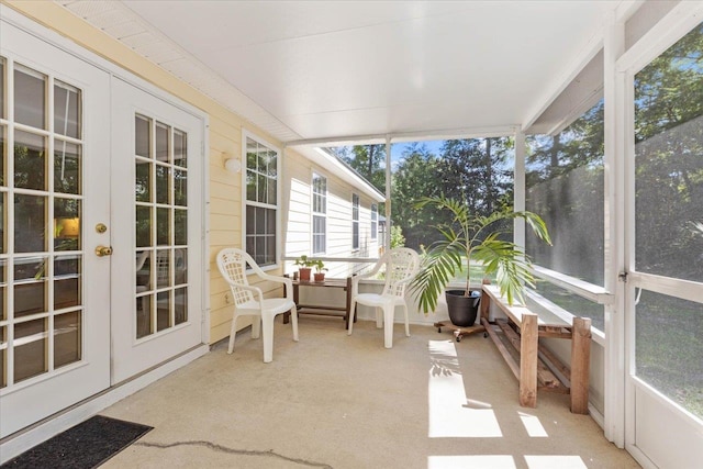 sunroom / solarium featuring french doors