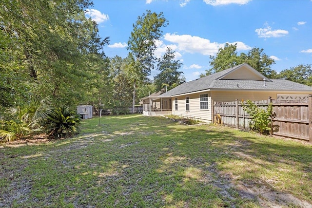 view of yard featuring a storage unit