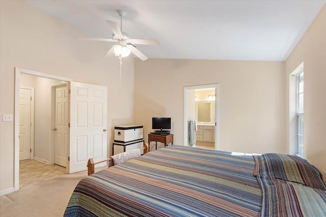 bedroom with ensuite bathroom, ceiling fan, lofted ceiling, and light colored carpet