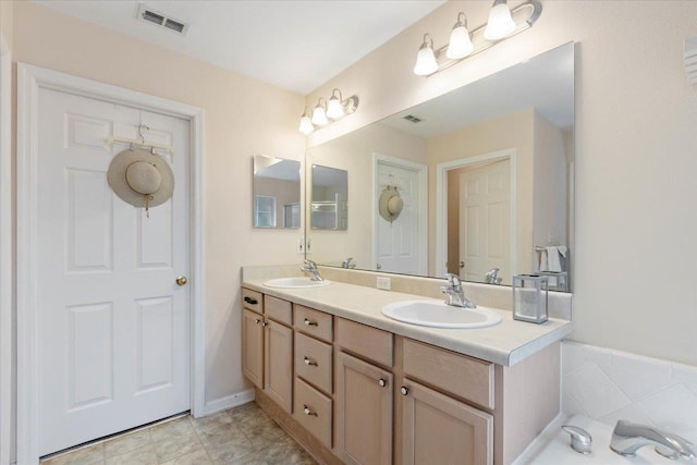 bathroom with vanity and tile patterned flooring