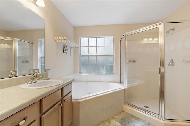 bathroom with vanity, independent shower and bath, and tile patterned floors