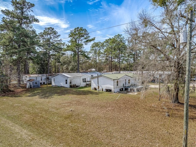 rear view of property with a yard