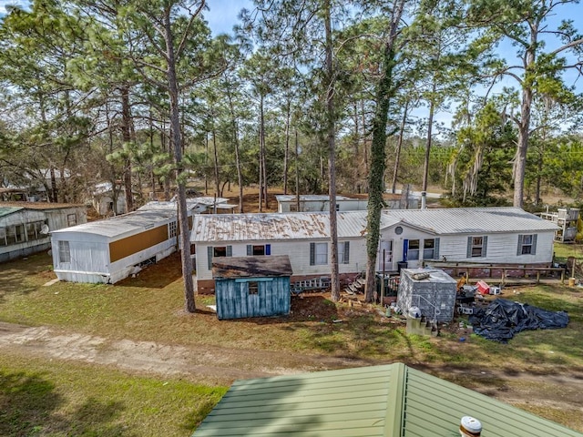 back of property with a storage unit