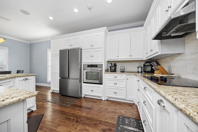 kitchen with dark hardwood / wood-style flooring, white cabinets, stainless steel appliances, and ornamental molding