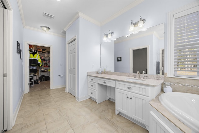 bathroom with vanity, crown molding, and tiled tub