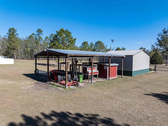 view of outbuilding with a yard