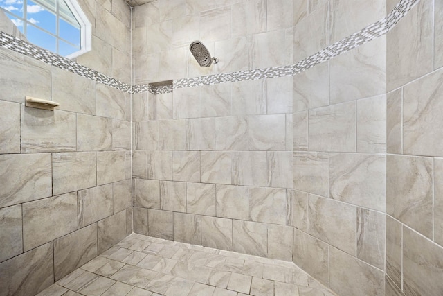 bathroom with tiled shower