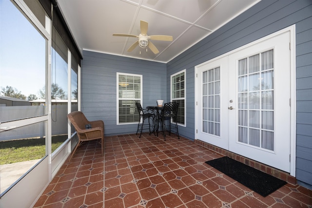 unfurnished sunroom with french doors and ceiling fan