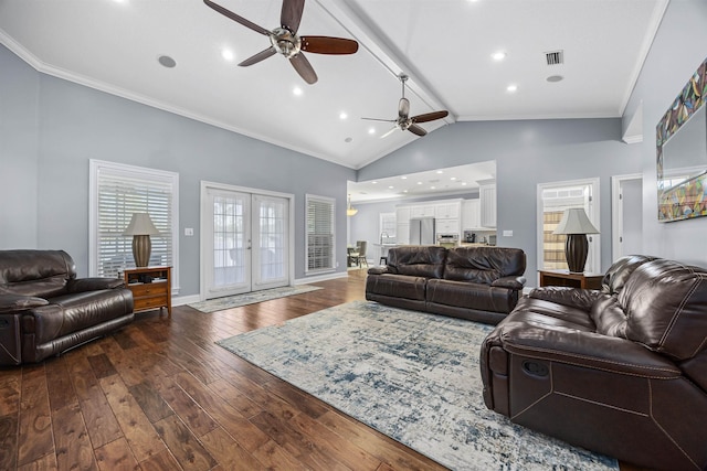 living room featuring french doors, ornamental molding, vaulted ceiling, ceiling fan, and dark wood-type flooring