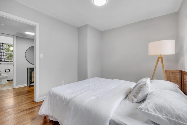 bedroom with light hardwood / wood-style flooring