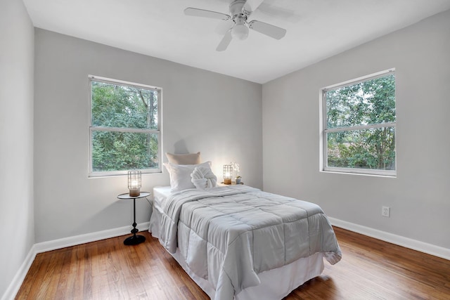 bedroom featuring wood-type flooring and ceiling fan