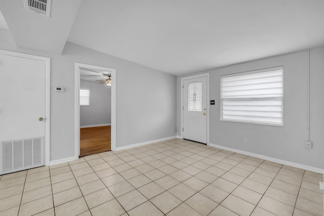 foyer entrance featuring ceiling fan