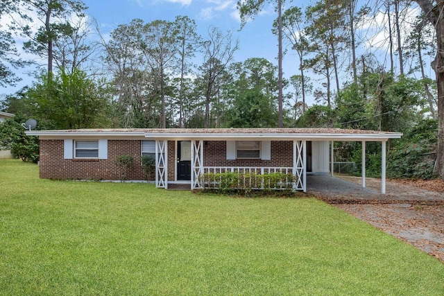 ranch-style home with a carport and a front yard