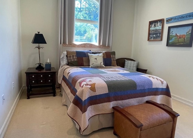 bedroom featuring baseboards and carpet flooring
