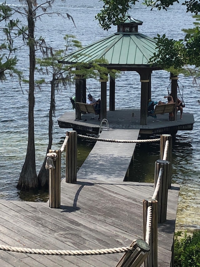 dock area with a water view and a gazebo