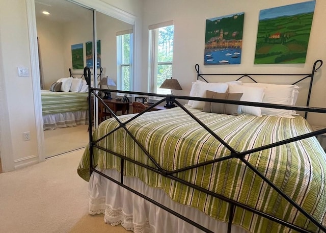 bedroom featuring baseboards and carpet