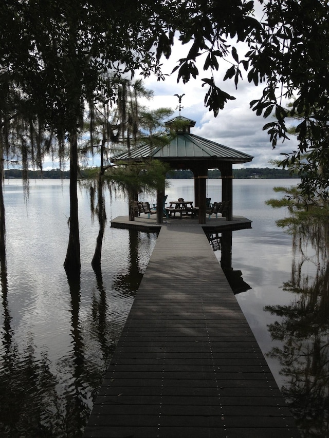 dock area featuring a gazebo and a water view