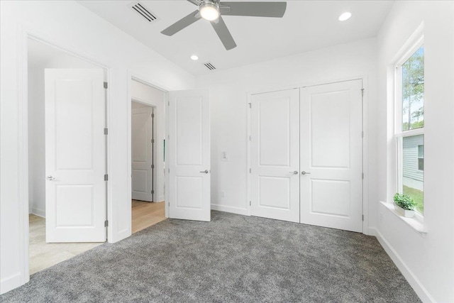 unfurnished bedroom featuring carpet floors, a closet, ceiling fan, recessed lighting, and baseboards