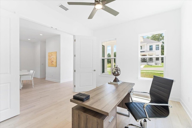 home office with ceiling fan, light wood-style floors, and baseboards