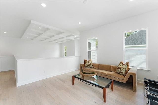 living area with light wood-style flooring, beam ceiling, healthy amount of natural light, recessed lighting, and baseboards
