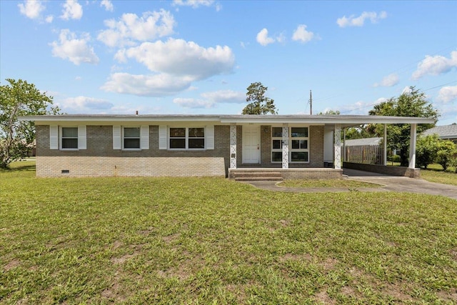 203 Forest Cir, Perry, FL 32347 - view of front of home featuring concrete driveway, brick siding, crawl space, and a carport