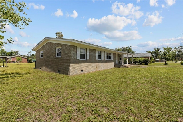 203 Forest Cir, Perry, FL 32347 - rear view of property featuring crawl space, brick siding, and a lawn