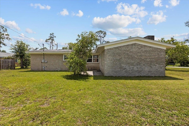 203 Forest Cir, Perry, FL 32347 - rear view of house featuring brick siding