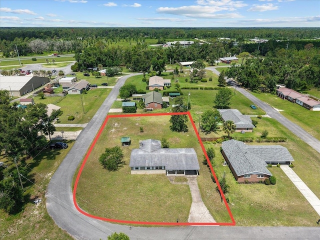 203 Forest Cir, Perry, FL 32347 - aerial perspective of suburban area with property boundaries highlighted and a heavily wooded area