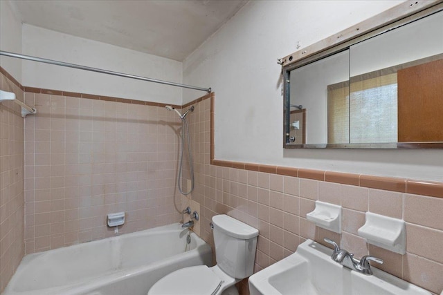 203 Forest Cir, Perry, FL 32347 - bathroom with bathtub / shower combination, tile walls, and a wainscoted wall