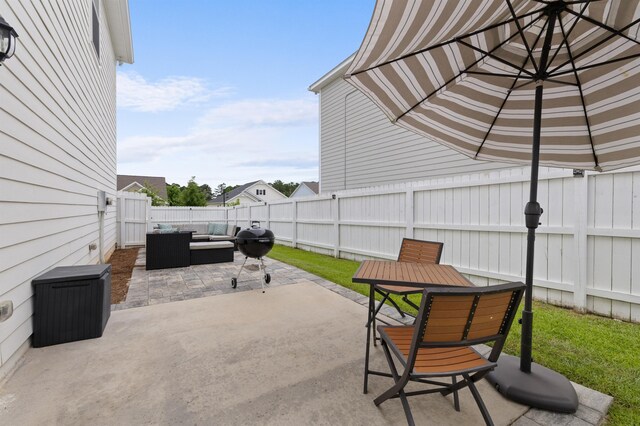 2848 Crestline Rd, Tallahassee, FL 32308 - fenced backyard featuring an outdoor living space, a patio, grilling area, and outdoor dining area
