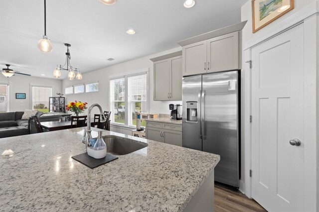2848 Crestline Rd, Tallahassee, FL 32308 - kitchen with stainless steel fridge, plenty of natural light, light stone counters, and recessed lighting