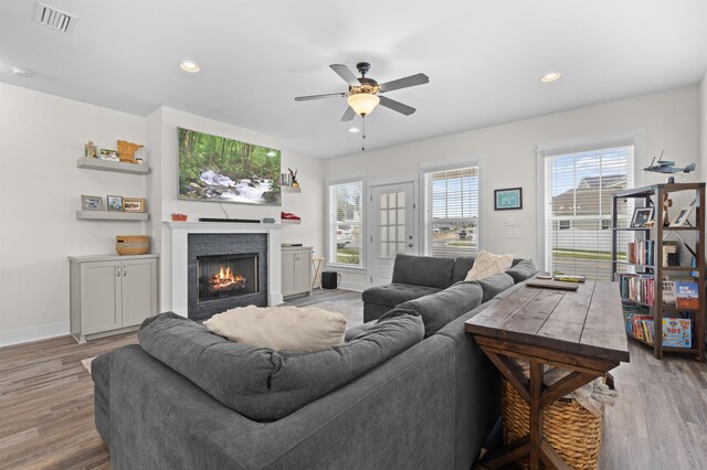 2848 Crestline Rd, Tallahassee, FL 32308 - living room with ceiling fan, wood finished floors, a lit fireplace, and recessed lighting