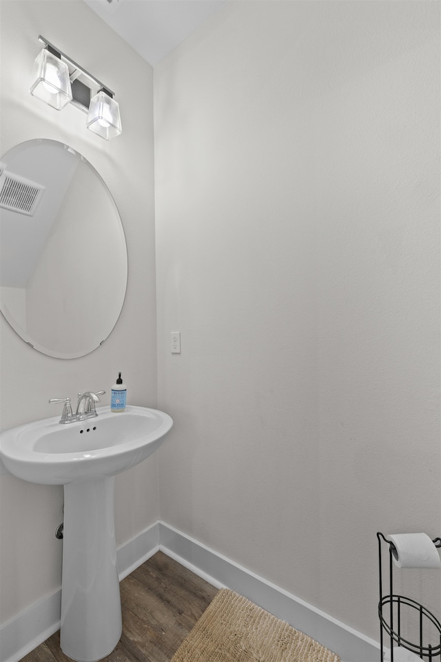 2848 Crestline Rd, Tallahassee, FL 32308 - bathroom featuring wood finished floors and baseboards