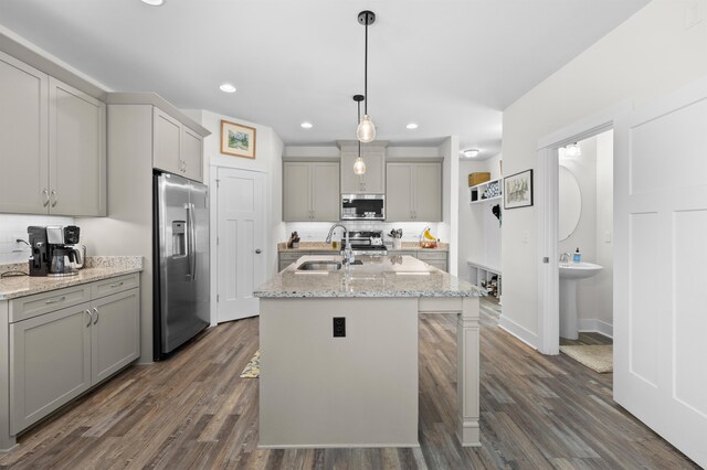 2848 Crestline Rd, Tallahassee, FL 32308 - kitchen with stainless steel appliances, gray cabinetry, dark wood-type flooring, recessed lighting, and a center island with sink