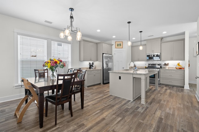 2848 Crestline Rd, Tallahassee, FL 32308 - kitchen featuring stainless steel appliances, gray cabinets, dark wood-type flooring, backsplash, and recessed lighting
