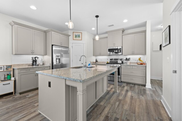 2848 Crestline Rd, Tallahassee, FL 32308 - kitchen featuring stainless steel appliances, tasteful backsplash, gray cabinets, dark wood-style floors, and recessed lighting