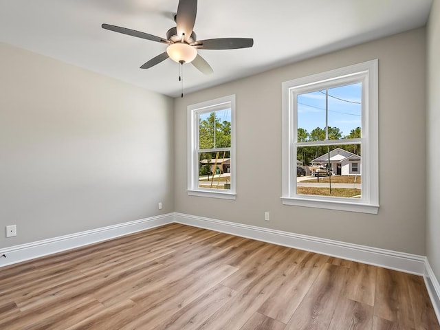 unfurnished room with ceiling fan and light hardwood / wood-style flooring