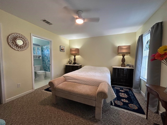 carpeted bedroom featuring ensuite bathroom and ceiling fan