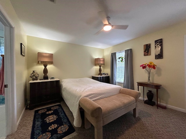 bedroom with ceiling fan and dark carpet