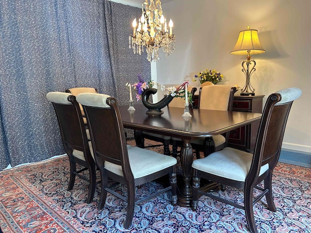 dining space with a chandelier