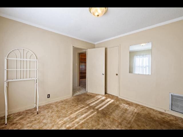 10168 NE Colin Kelly Hwy, Pinetta Madison County, FL 32350 - unfurnished bedroom featuring ornamental molding and carpet floors