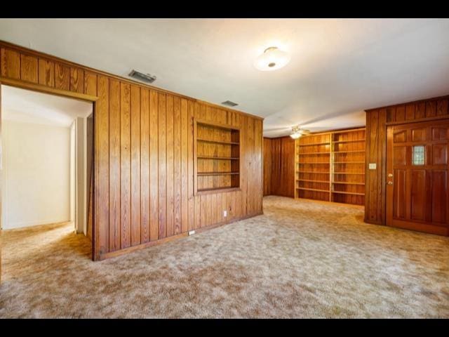 10168 NE Colin Kelly Hwy, Pinetta Madison County, FL 32350 - carpeted empty room featuring wooden walls and built in features