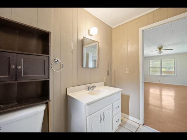 10168 NE Colin Kelly Hwy, Pinetta Madison County, FL 32350 - bathroom with toilet, vanity, tile patterned flooring, ceiling fan, and ornamental molding