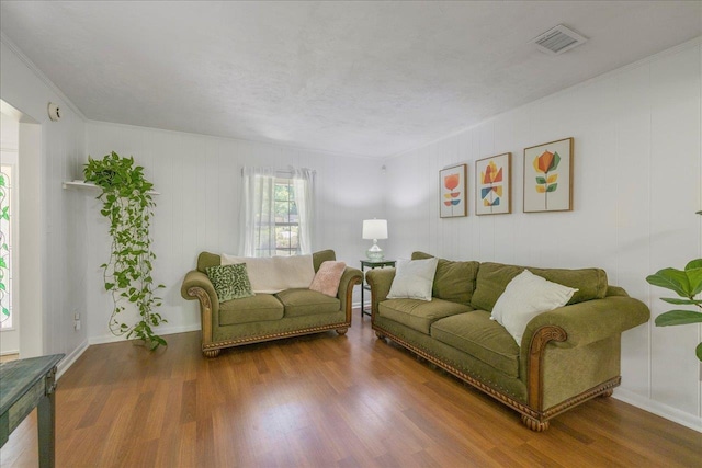 3822 Leane Dr, Tallahassee, FL 32309 - living room with wood finished floors, crown molding, and baseboards