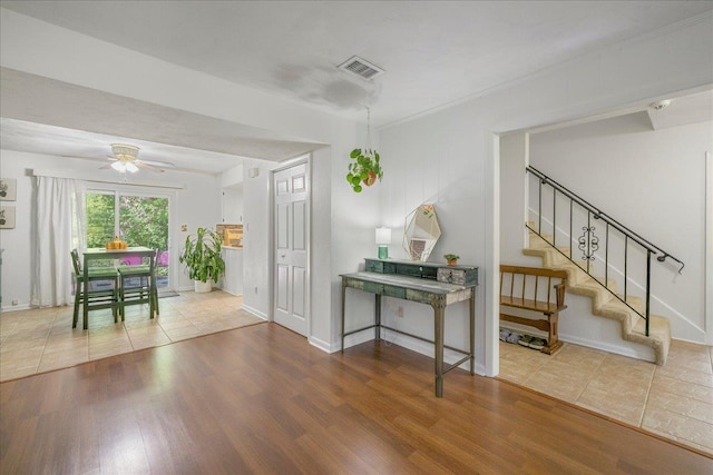 3822 Leane Dr, Tallahassee, FL 32309 - foyer entrance featuring wood finished floors, stairs, baseboards, and ceiling fan