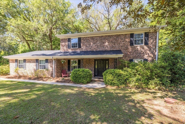 3822 Leane Dr, Tallahassee, FL 32309 - traditional-style house featuring a front yard, brick siding, and a porch
