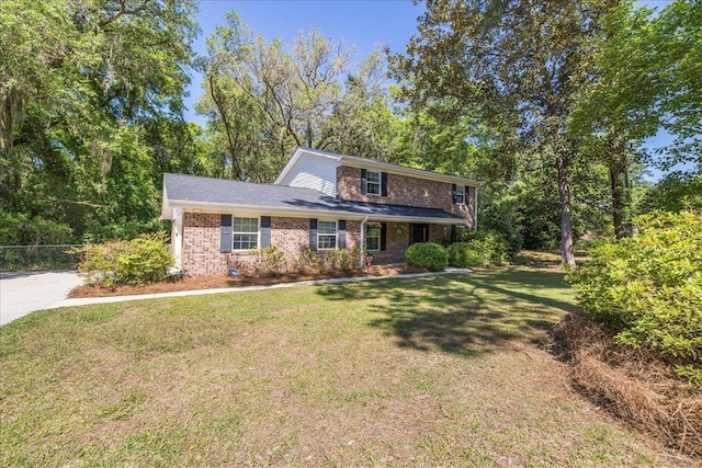 3822 Leane Dr, Tallahassee, FL 32309 - traditional-style home with brick siding and a front lawn