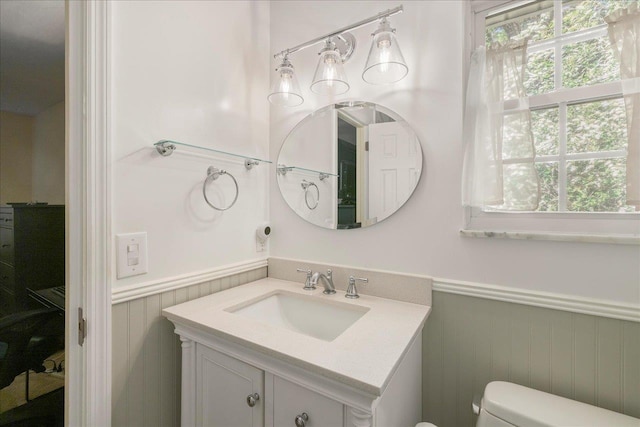 3822 Leane Dr, Tallahassee, FL 32309 - bathroom with wainscoting, toilet, and vanity